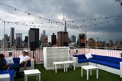 07-07 Outdoor Bar And DJ With View To World Trade Center And Financial District From The Rooftop At NoMo SoHo New York City.jpg